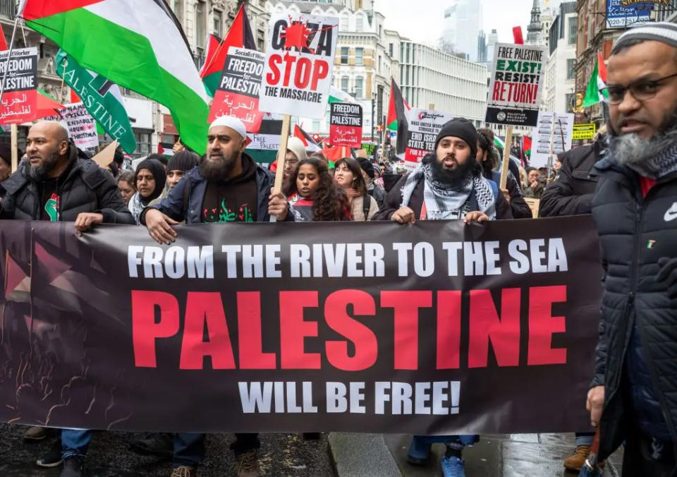 Protesters holding anti-Israel banners