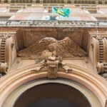 Protester pulls down national flag from Iranian embassy in London – The Guardian